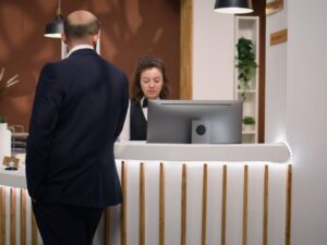 businessman-talks-staff-member.jpg