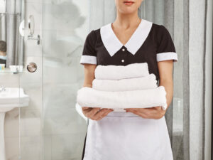 everything-is-fresh-clean-cropped-portrait-housecleaner-maid-uniform-holding-pack-white-towels-employee-brought-everything-customer-ordered-his-hotel-room.jpg