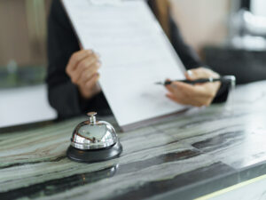 hotel-receptionist-uniforms-desk-lobby-friendly-welcome-staff-hotel-reception-counter.jpg