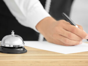 service-bell-desk-blurred-receptionist-hotel.jpg