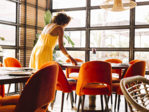 woman-arranging-dishware-table-restaurant.jpg